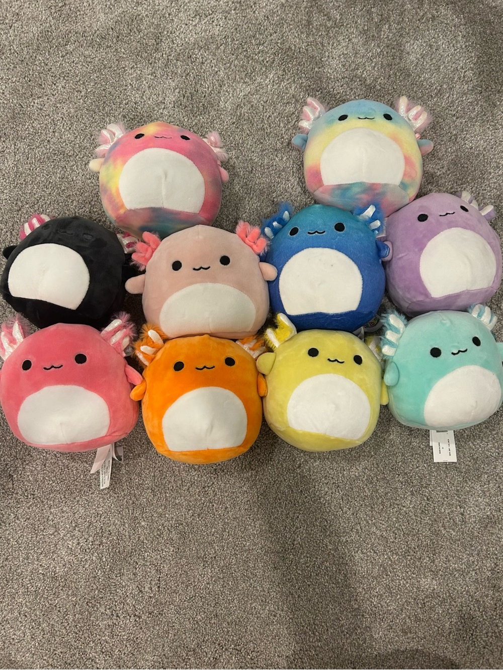 10 Squishmallow axolotls in various colors